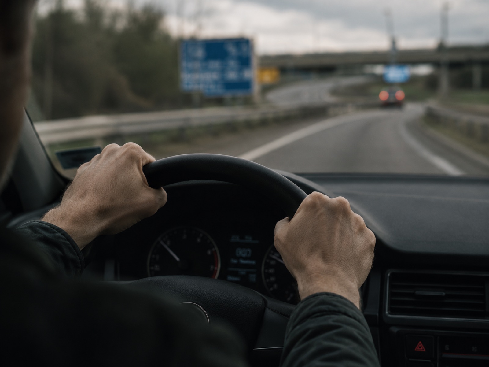 A driver feeling anxious as they approach a busy motorway.
